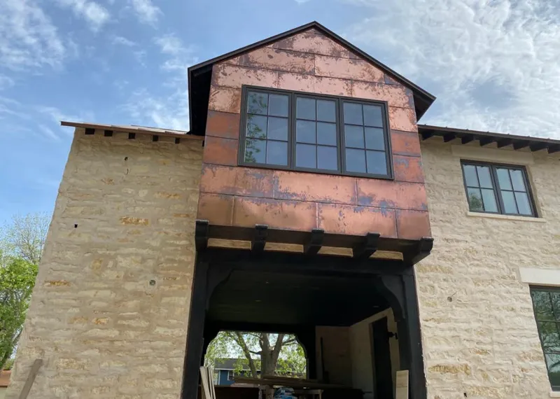 Copper metal panel facade on a stone building for Roof Repair in Sharon Hill